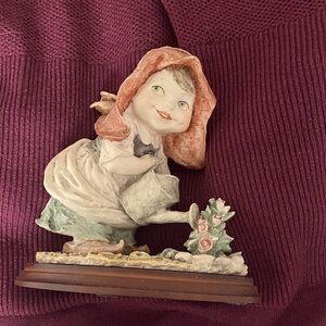 Charming Ceramic Girl Figurine with Red and Green Accents